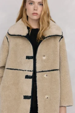 Abrigo reversible de efecto pelo