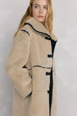 Abrigo reversible de efecto pelo