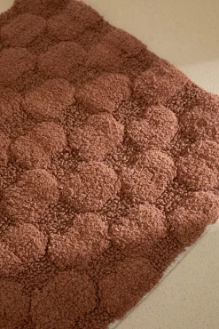 Alfombra de baño a cuadros en tono tierra Oslo