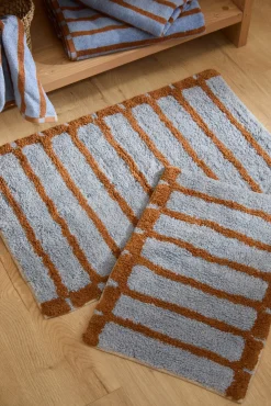 Alfombra de baño a rayas azules Saturno