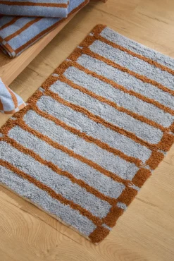 Alfombra de baño a rayas azules Saturno