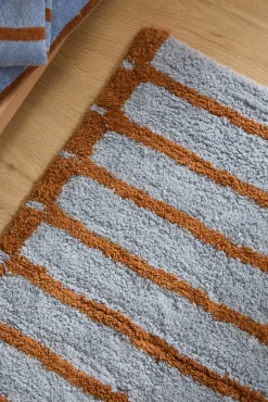 Alfombra de baño a rayas azules Saturno