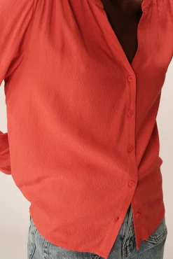 Blusa con corte regular de mangas largas