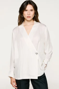 Blusa cuello pico detalle metálico