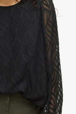 Blusa manga larga con cuello redondo