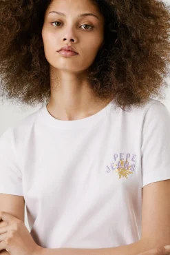 Camiseta manga corta con logo bordado y dibujo trasero.