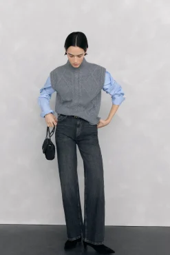 Chaleco abotonadura central y ochos espalda