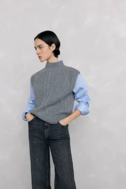 Chaleco abotonadura central y ochos espalda