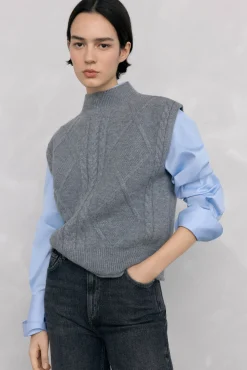 Chaleco abotonadura central y ochos espalda