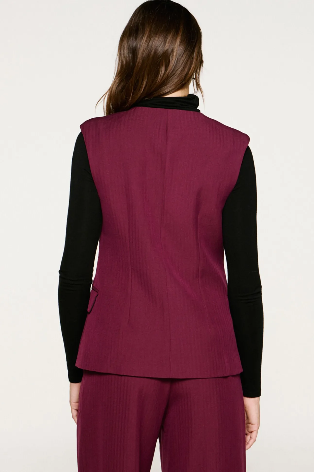 Chaleco traje bolsillos.