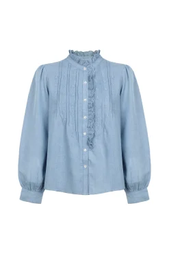 Cintia. Blusa con volante en la tapeta