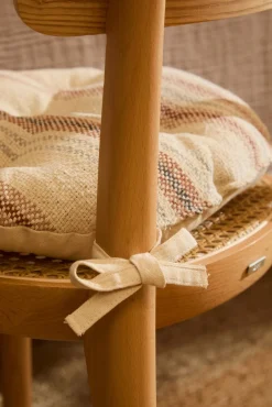 Cojín de silla redondo a rayas en tonos tierra Peru