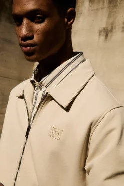 Cárdigan cremallera logo