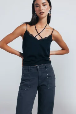 Jeans culotte tachas