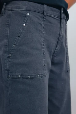 Jeans culotte tachas