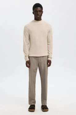 Jersey cuello mock 100% lana merino.