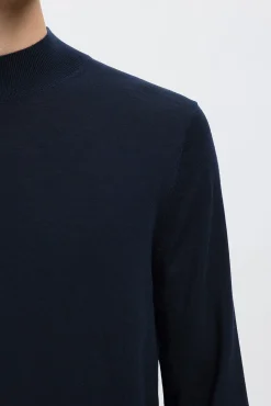 Jersey cuello mock 100% lana merino.