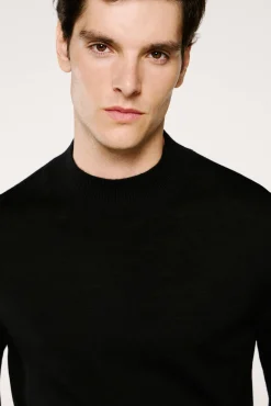 Jersey cuello mock 100% lana merino.