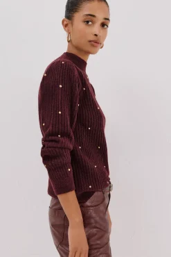 Jersey tachas doradas