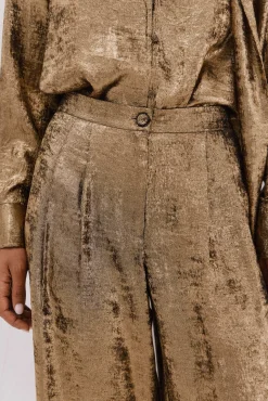 Pantalón dorado palazzo