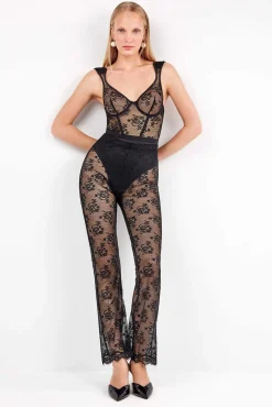 Pantalón largo elástico de encaje floral transparente y delicado