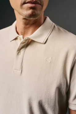 Polo piqué lavado bordado avión