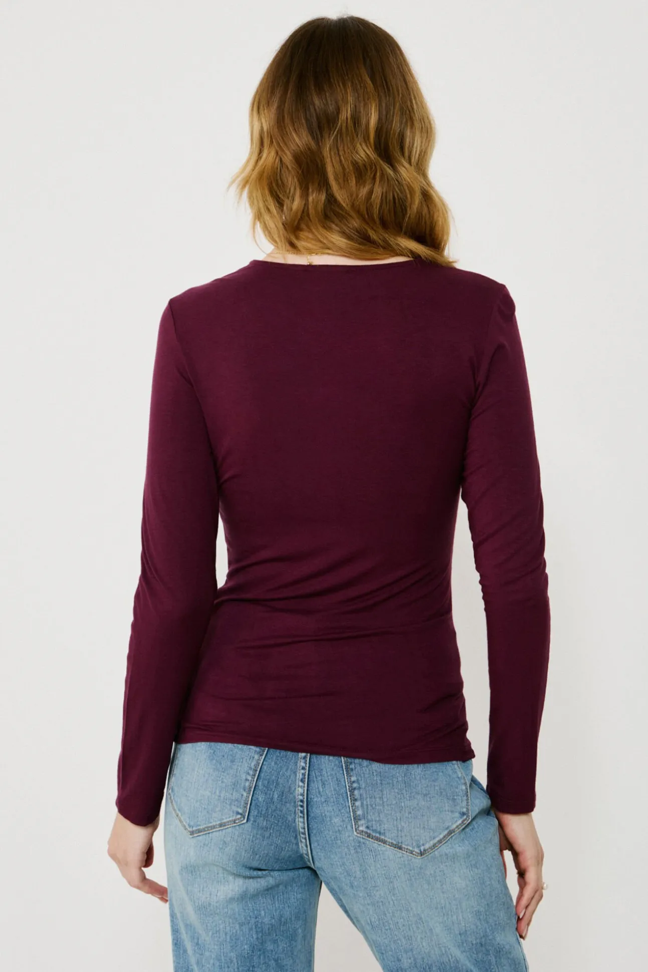 Top de manga larga con detalle drapeado