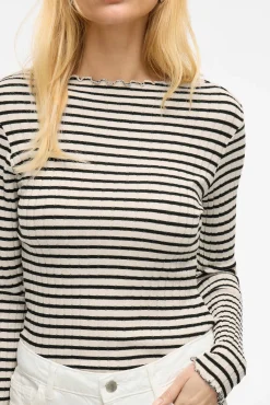 Top de manga larga con ribetes