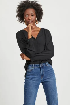 Top de mujer de manga larga con escote en pico