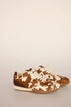 Zapatillas de piel con estampado vaca